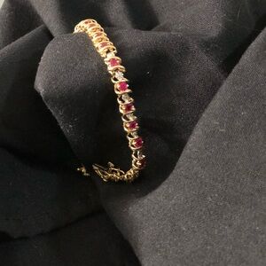 Radiant Gold and Red Bracelet with Intricate Design